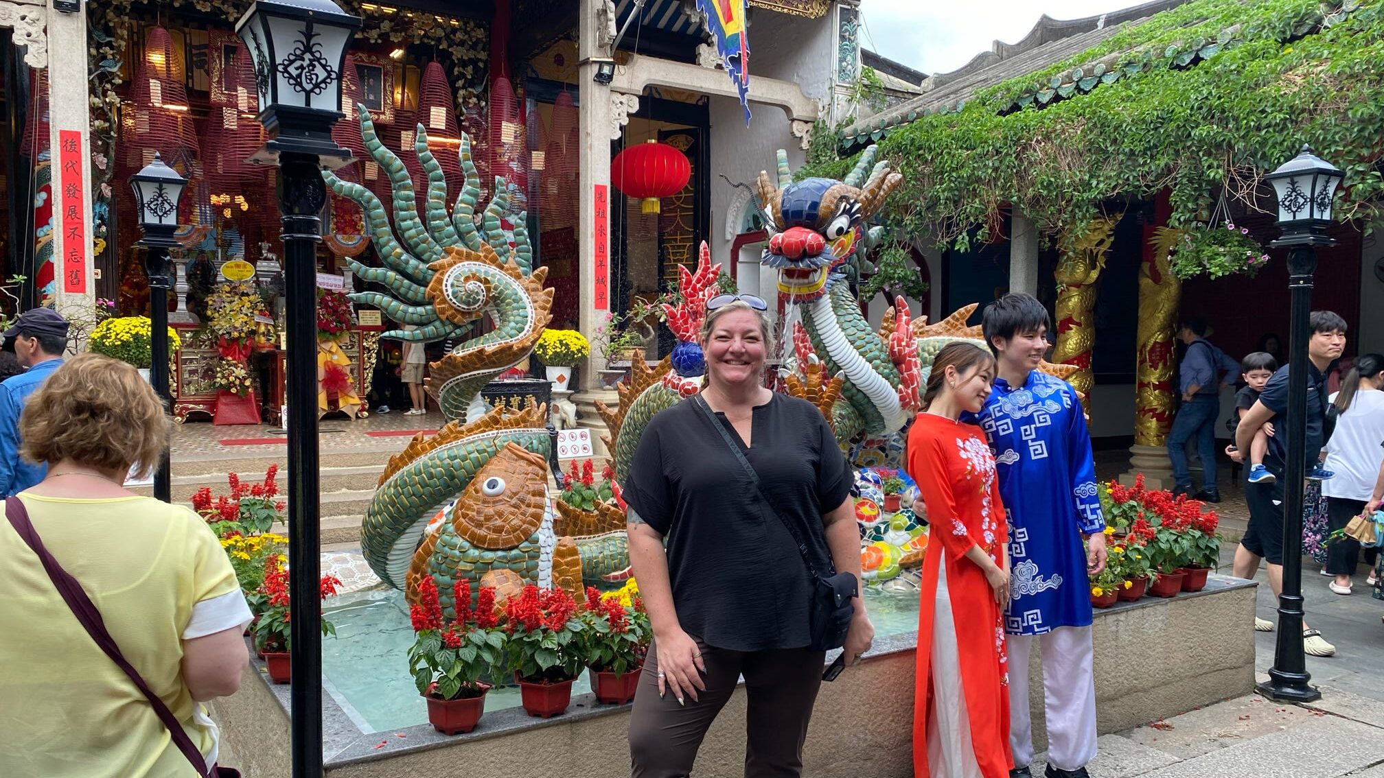 person standing in front of temple in Hoi An