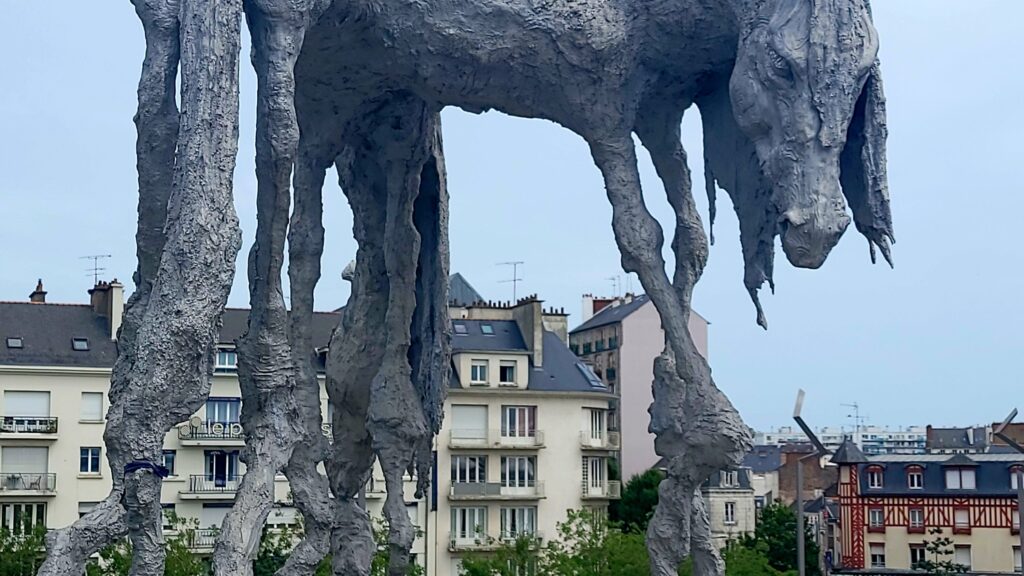 sculpture in front of Rennes  to mont saint michel train station