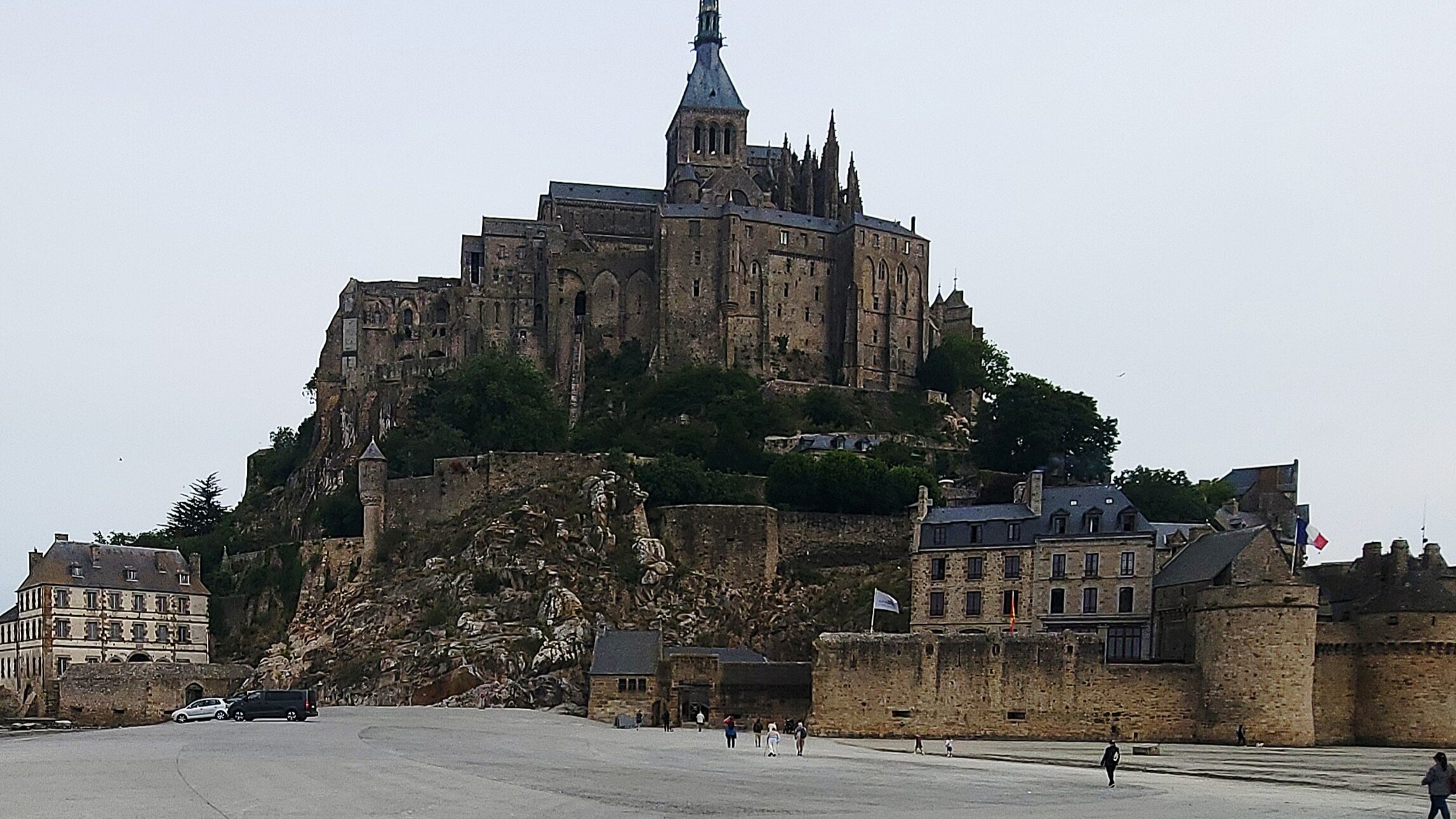 luggage in front of mont saint michel