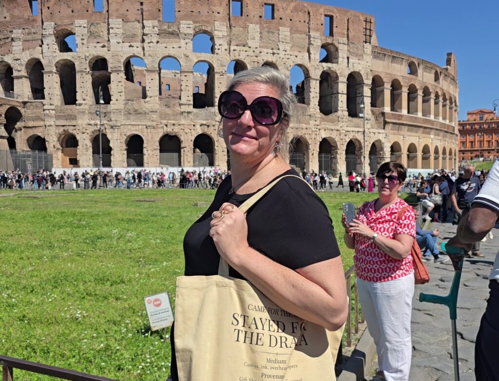 Person standing in front of the colosseum