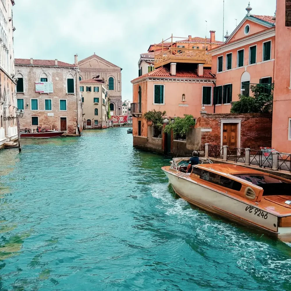 Picturesque view of Venice's canals with charming architecture and traditional boat.